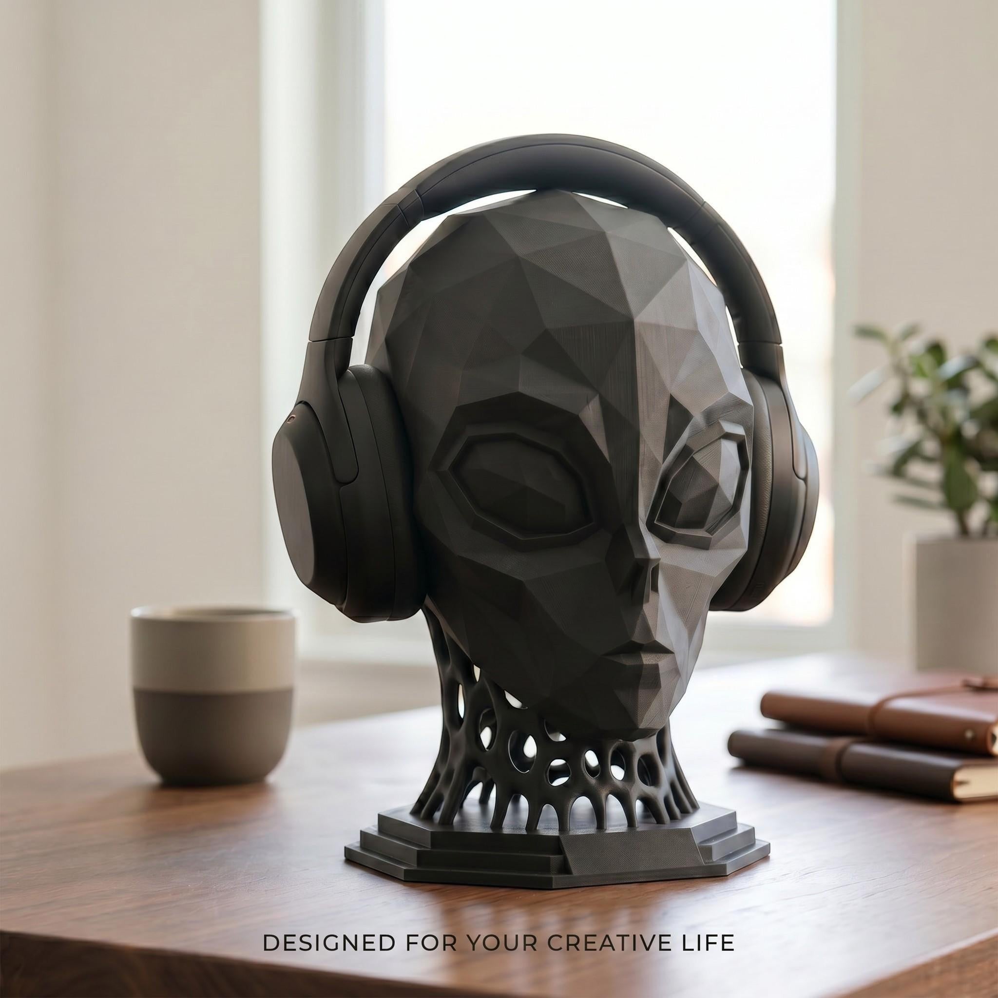 Happy3dWorld matte black low-poly alien headphone stand with a geometric voronoi neck on a wooden desk.