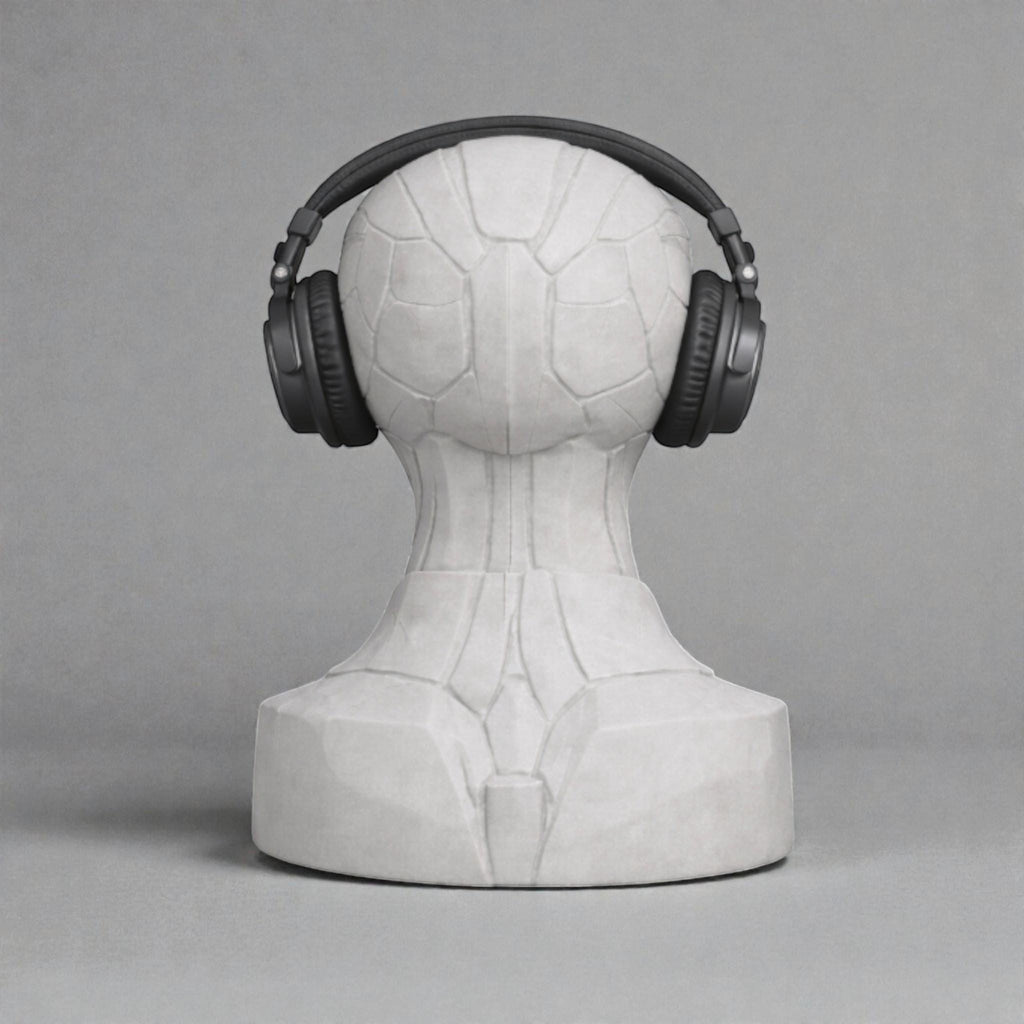 Happy3dWorld alien bust headphone stand holding black over-ear headphones against a neutral grey background