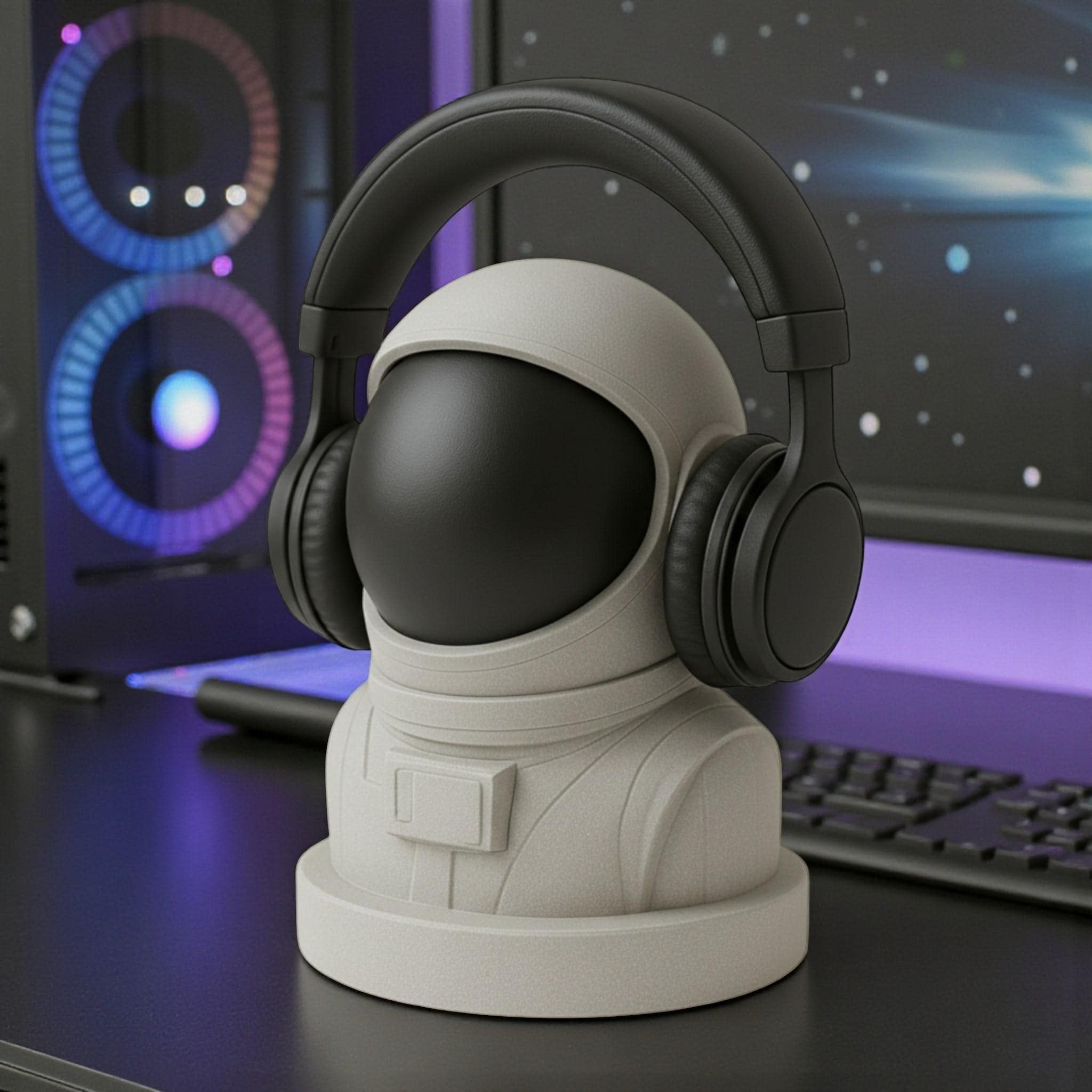 Happy3dWorld white and black astronaut headphone stand holding a black headset on a gaming desk with purple lighting.