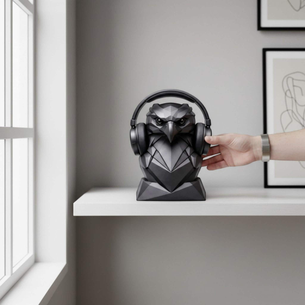 Happy3dWorld matte black geometric eagle headphone stand holding over-ear headphones on a white desk shelf