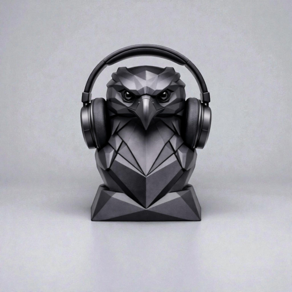 Happy3dWorld black geometric low-poly eagle headphone stand holding over-ear headphones on a desk