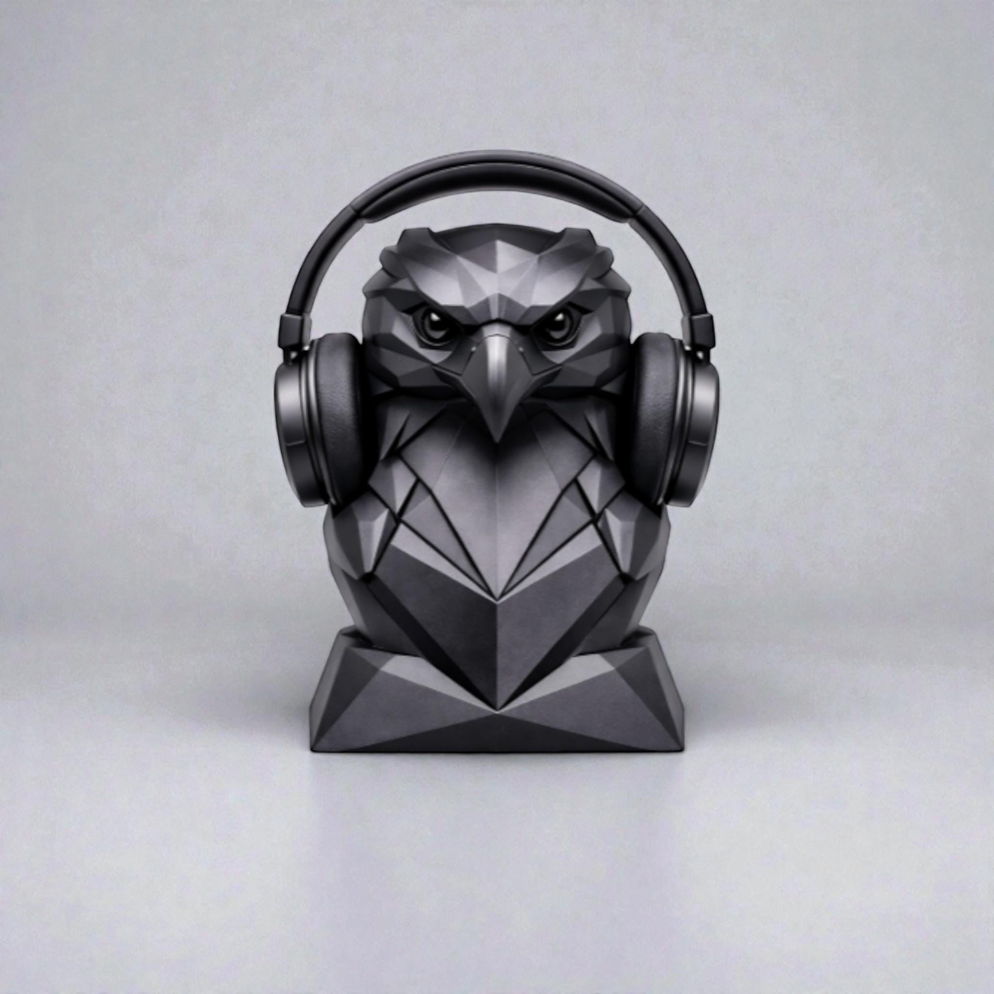 Happy3dWorld black geometric low-poly eagle headphone stand holding over-ear headphones on a desk