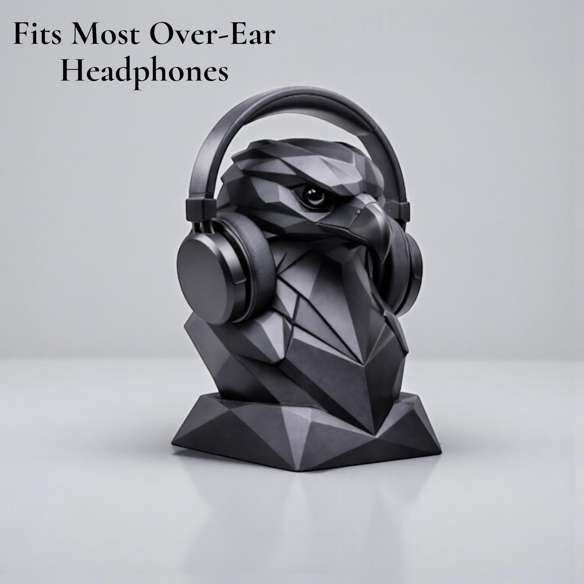 Happy3dWorld black geometric eagle bust headphone stand with low-poly design holding over-ear headphones on a desk
