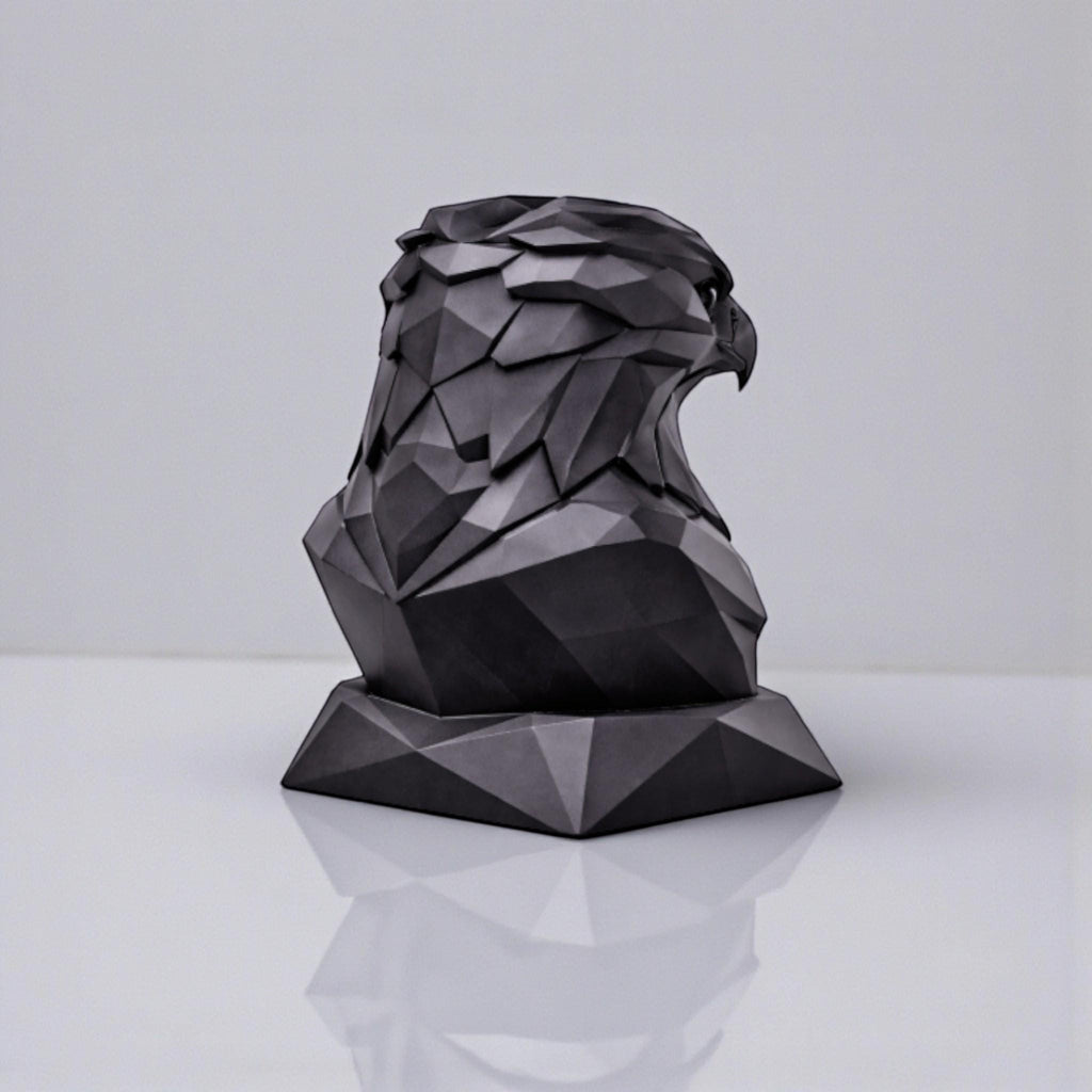 Happy3dWorld black matte 3D printed geometric eagle headphone stand with a low-poly faceted design on a white surface.