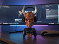 Happy3dWorld cyberpunk skull headset and controller stand with metallic copper finish on a gaming desk