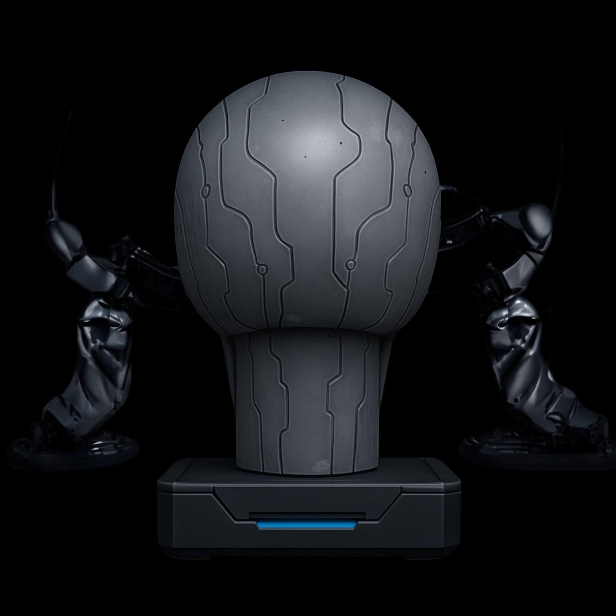Happy3dWorld matte silver cybernetic skull headphone stand with engraved circuit patterns and a stable blue-accented base.
