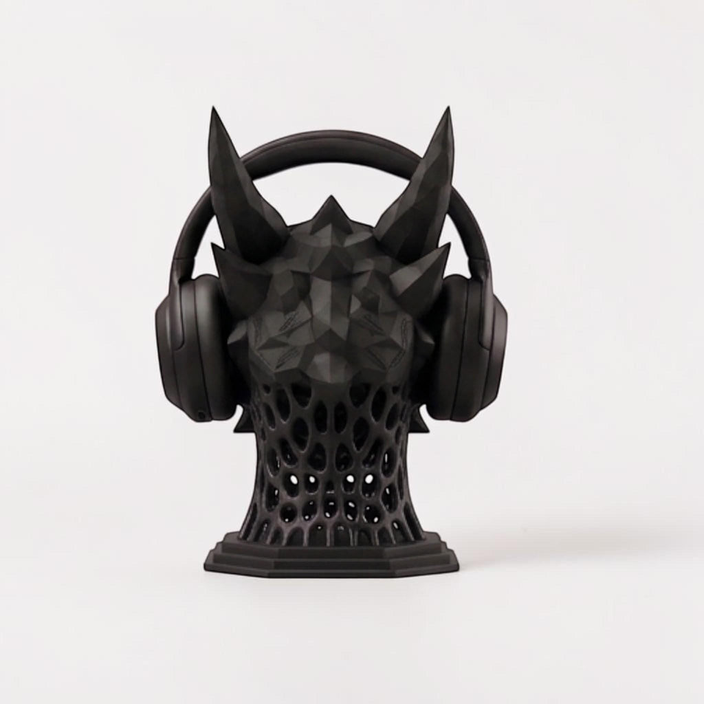 Happy3dWorld matte black 3D printed dragon headset stand with geometric low-poly design and lattice base.