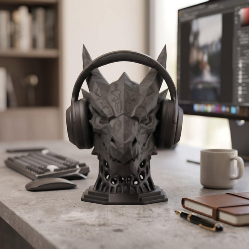 Happy3dWorld matte black 3D printed dragon headset stand with geometric sci-fi design on a modern gaming desk.