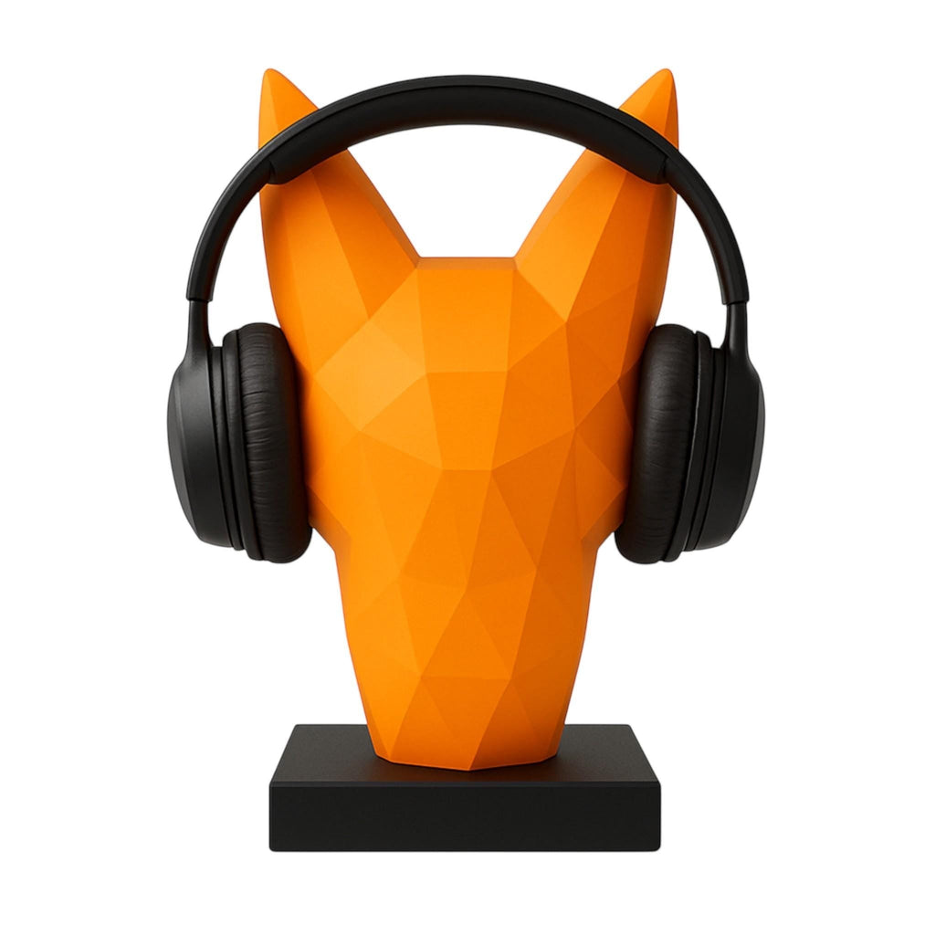 Happy3dWorld orange low-poly geometric fox headphone stand holding black over-ear headphones on a desk