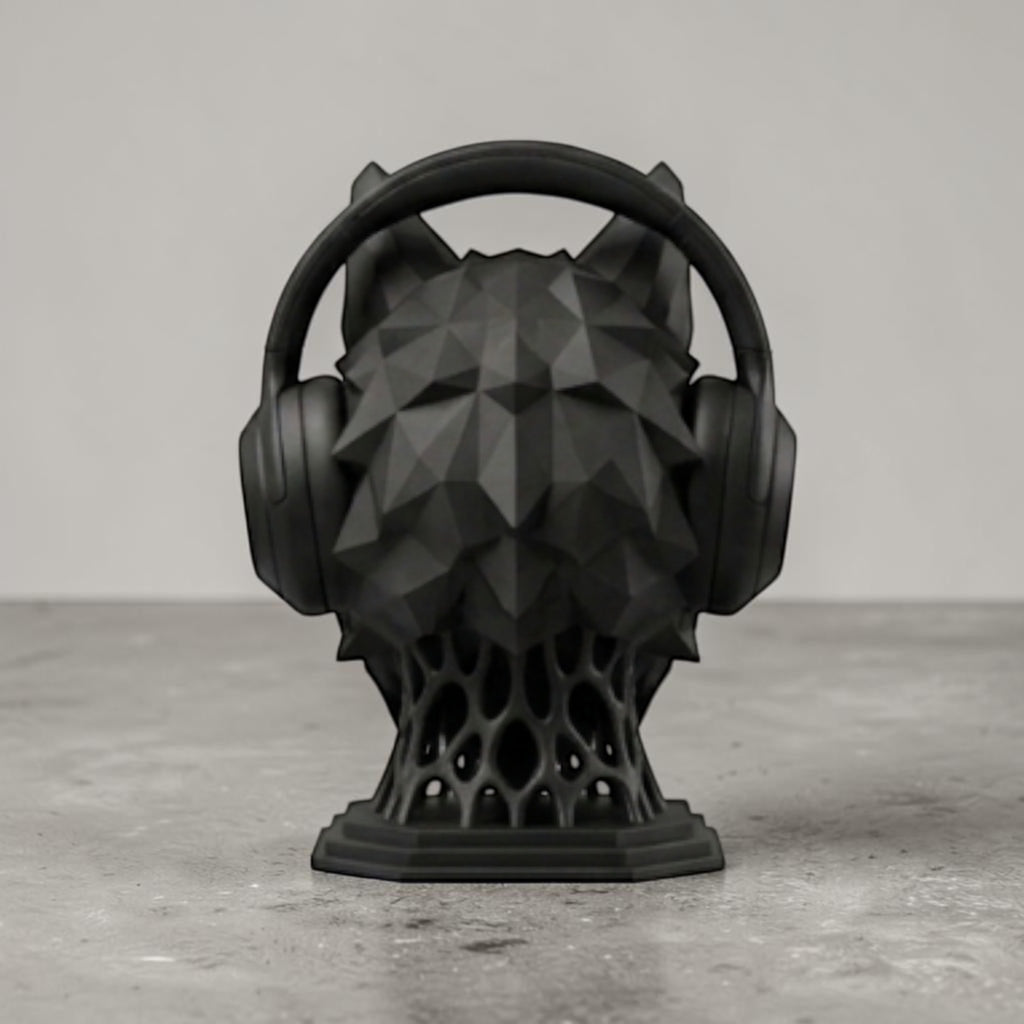Happy3dWorld matte black geometric wolf head headphone stand with a low-poly design on a grey desk surface.