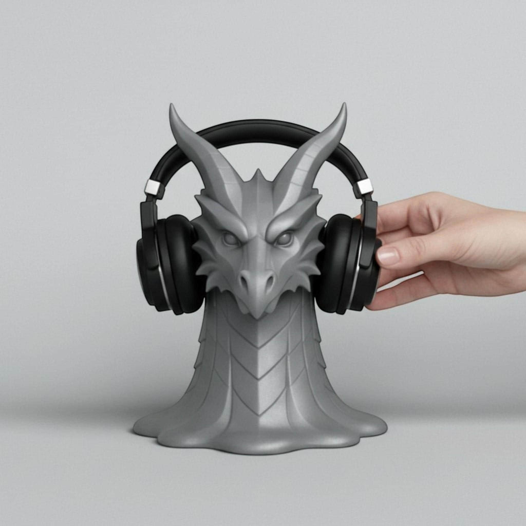 Happy3dWorld gray 3D printed dragon head headphone stand with intricate scales and horns holding black headphones