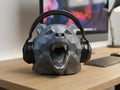 Happy3dWorld grey low polygon bear headphone stand on a wooden desk with black headphones