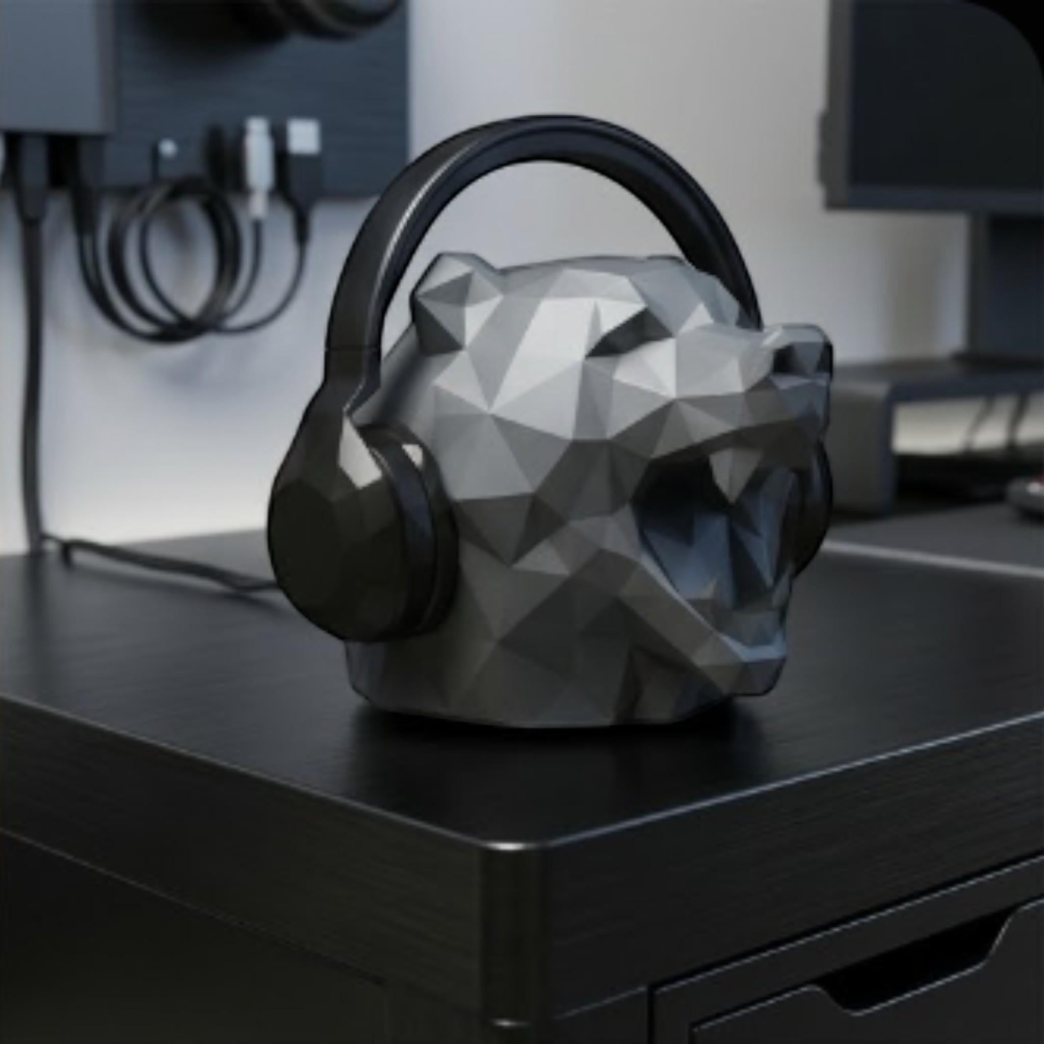 Happy3dWorld grey low-polygon bear head headphone stand with a matte finish on a modern black desk.