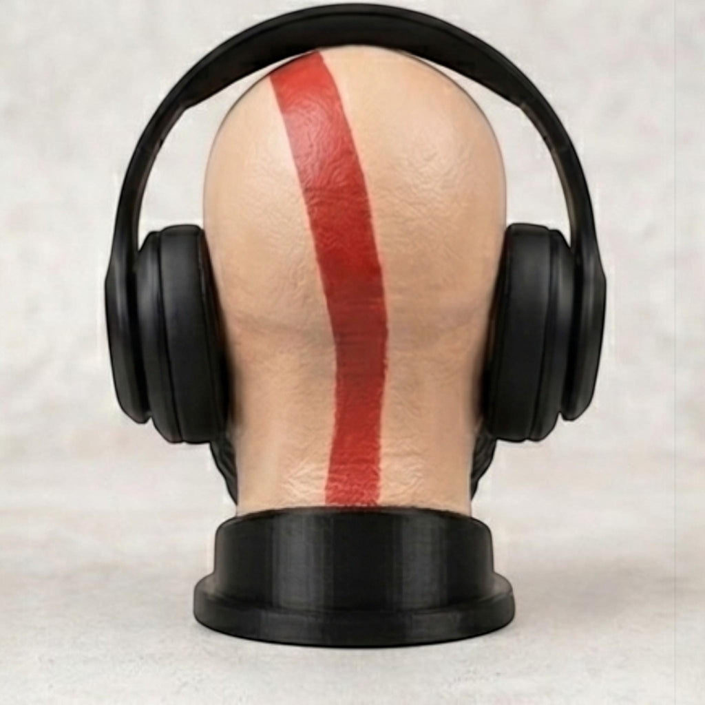 Happy3dWorld Kratos God of War bust headset stand with a red tattoo stripe, holding black gaming headphones.