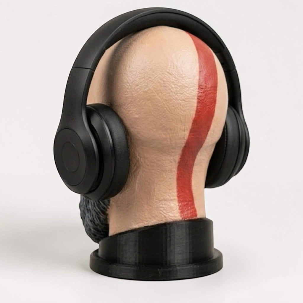 Happy3dWorld Kratos bust headset stand with a red tattoo stripe, displaying black gaming headphones on a white background