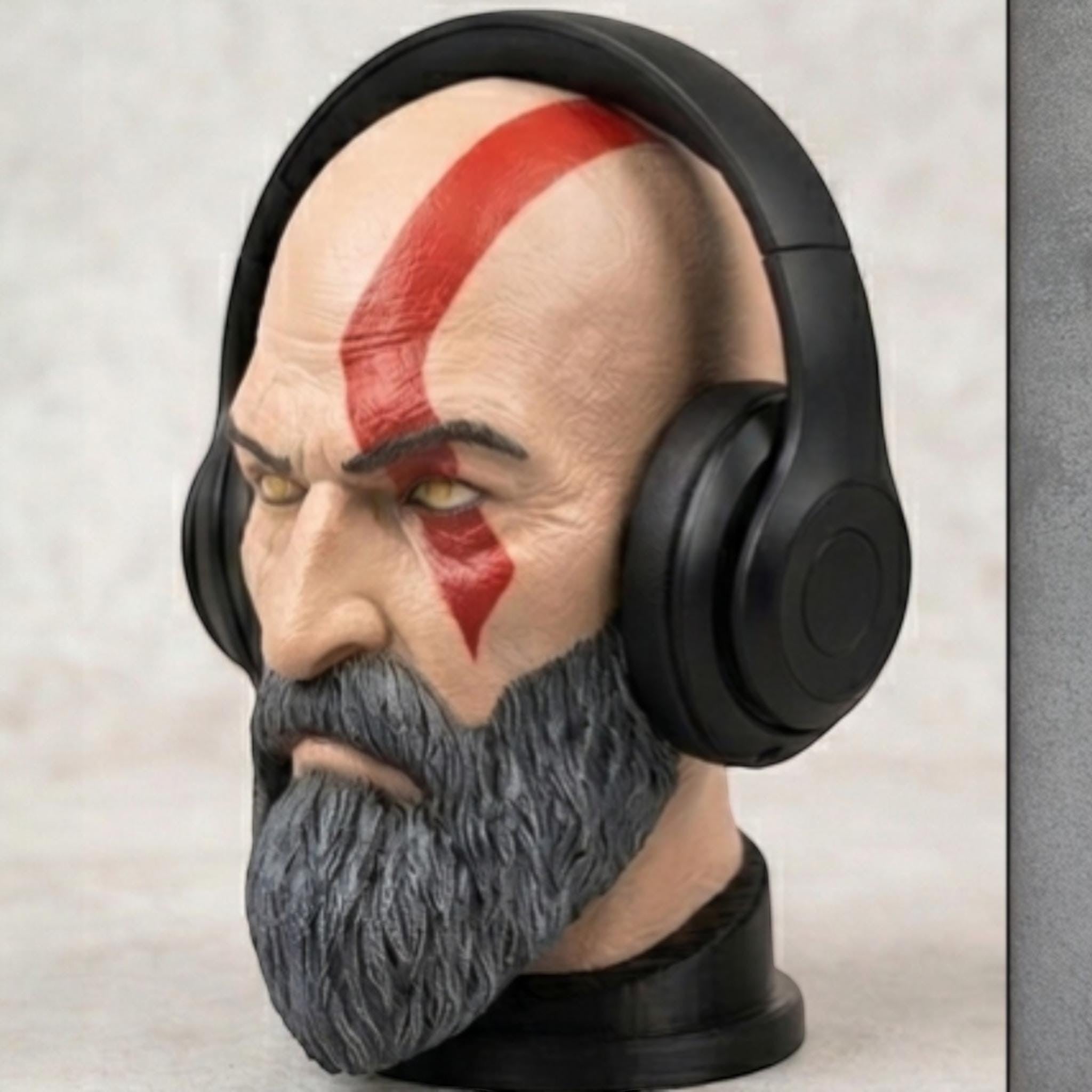 Happy3dWorld Kratos bust headset stand with detailed red tattoo and grey beard holding black gaming headphones