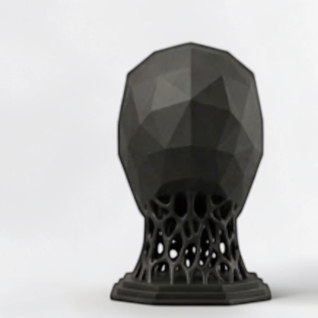Happy3dWorld matte black 3D printed low poly alien headphone stand with a geometric voronoi neck and octagonal base.