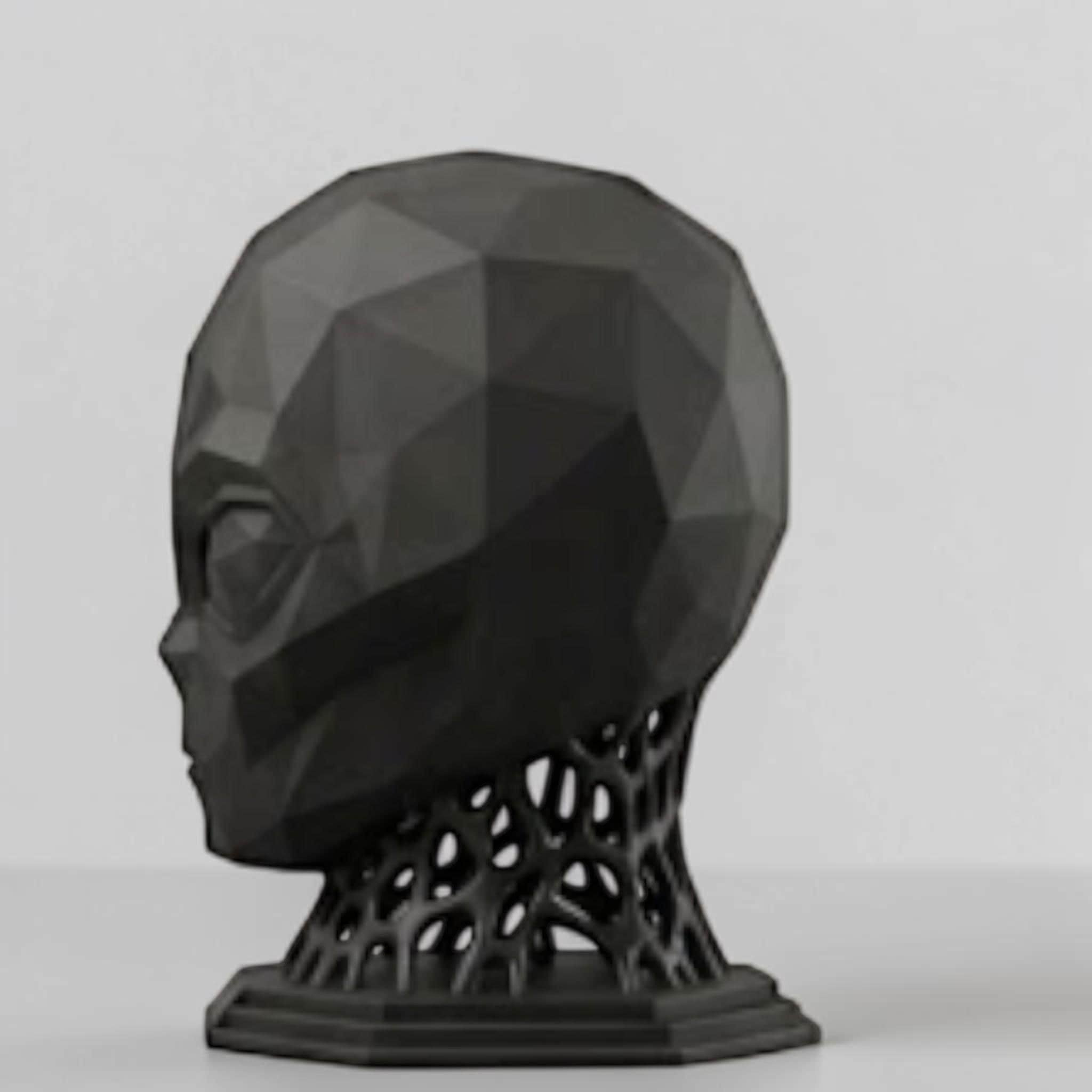 Happy3dWorld matte black low-poly alien headphone stand with a geometric voronoi neck design on a desk.