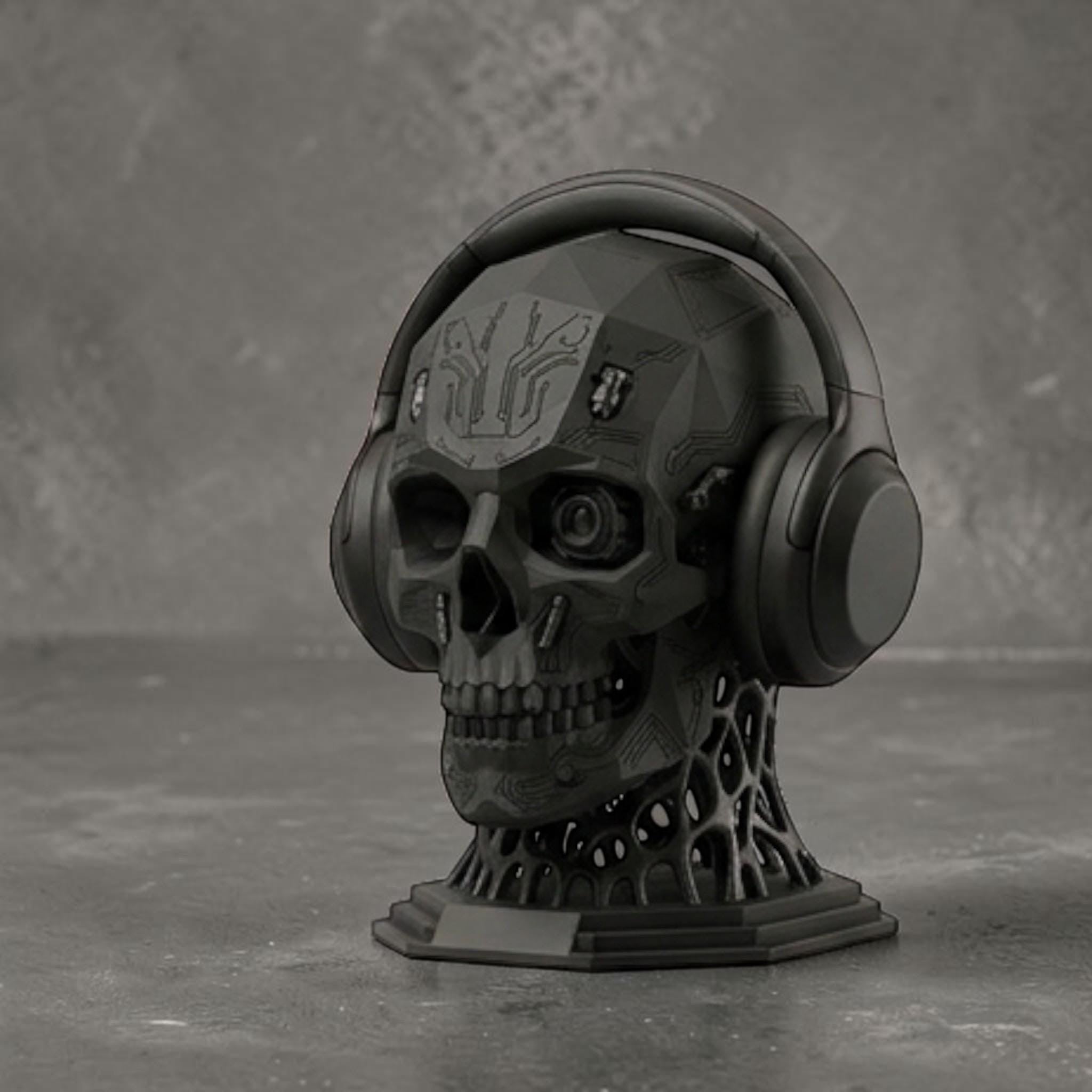 Happy3dWorld matte black mechanical skull headphone stand with intricate cybernetic details and a bio-mechanical base.