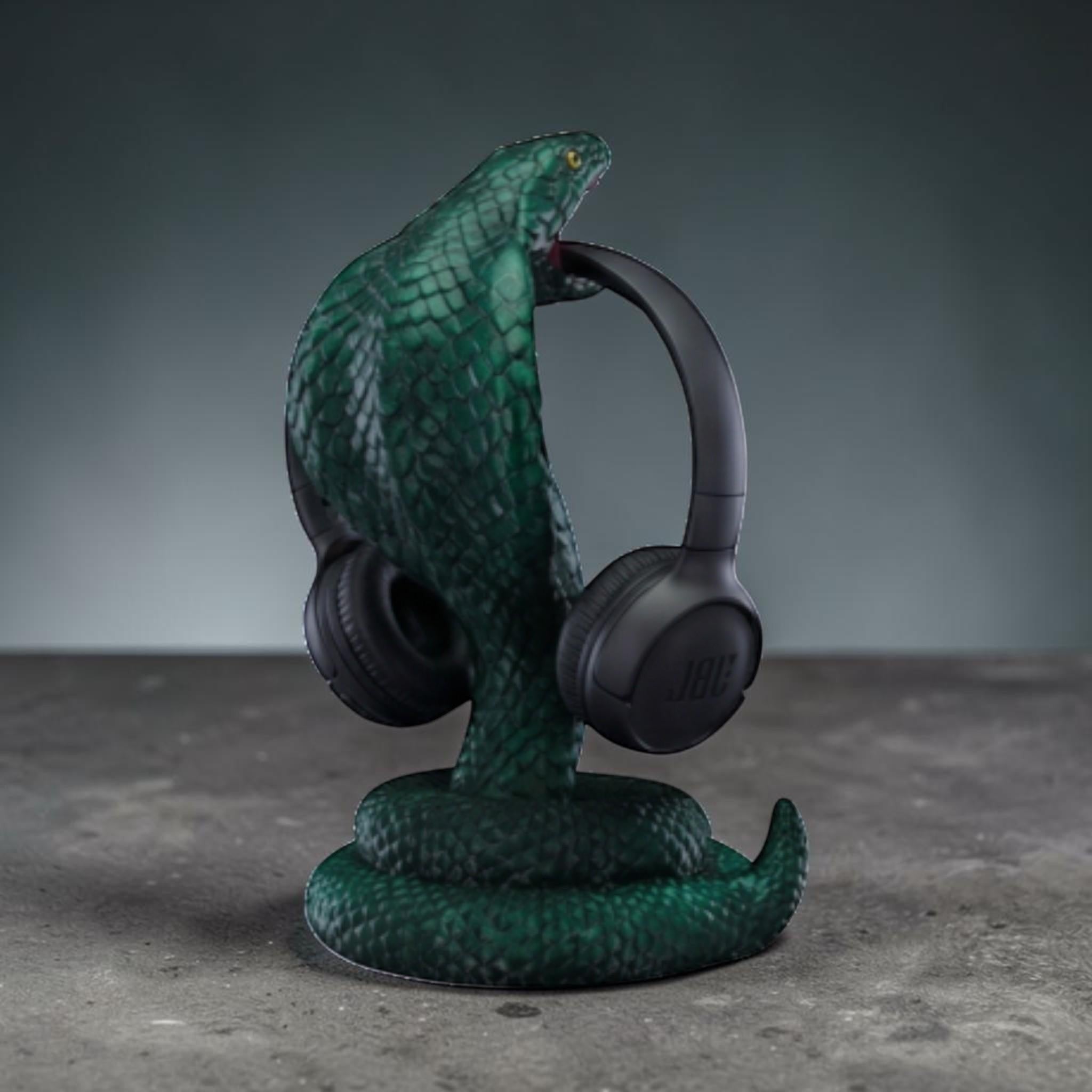 Happy3dWorld metallic green 3D printed cobra snake headphone stand with detailed scales holding black over-ear headset.