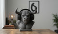 Happy3dWorld grey Minotaur bust headphone stand holding black over-ear headset on a wooden desk
