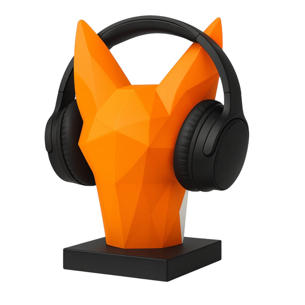 Happy3dWorld orange low-poly geometric fox headphone stand holding black over-ear headphones on a desk