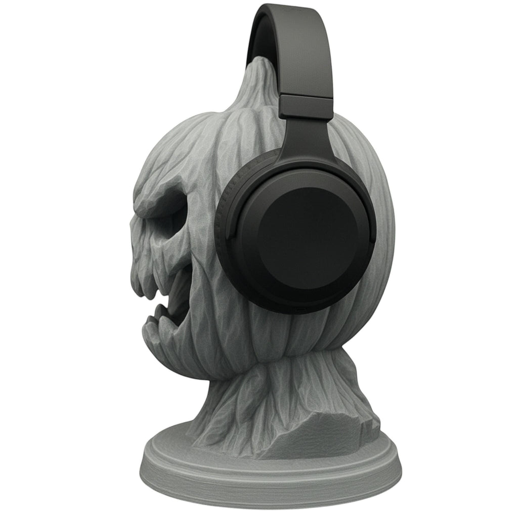 Happy3dWorld 3D printed grey pumpkin skull headphone stand with matte finish holding black over-ear headphones.