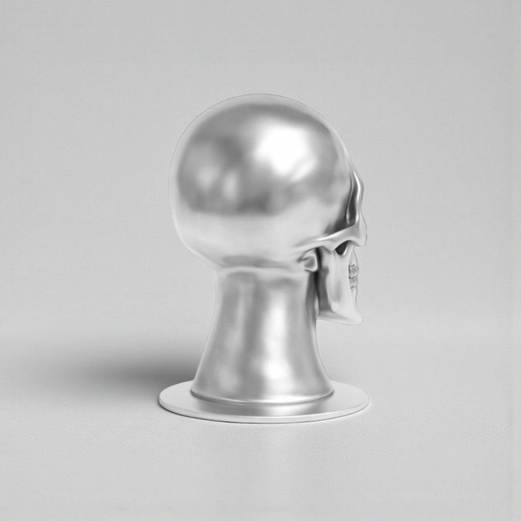 Happy3dWorld silver chrome skull headphone stand with a smooth metallic finish for cyberpunk gaming desk setups.